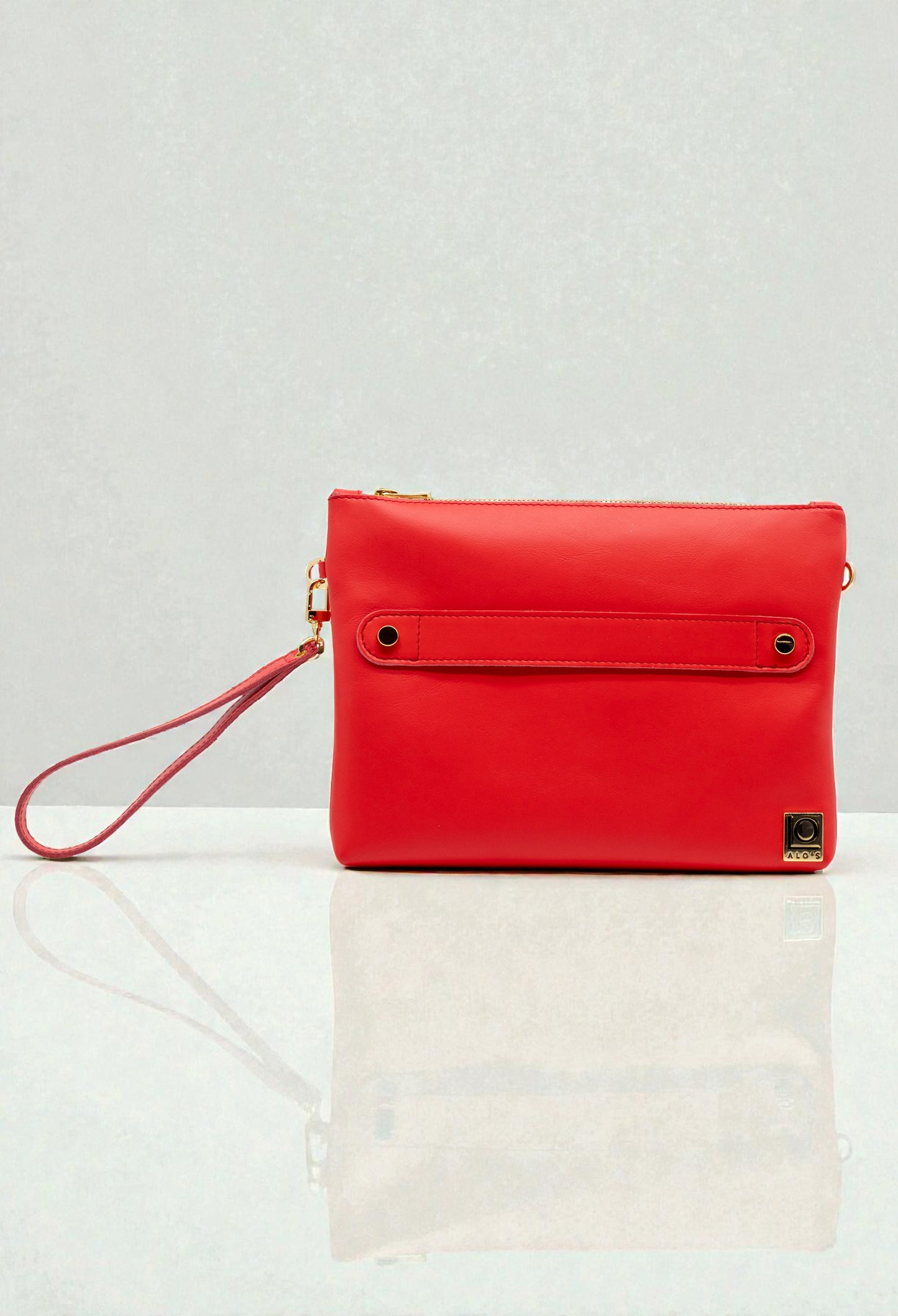 pochette rossa artigianale in pelle rosso geranio made in italy borsa a mano con braccialetto
